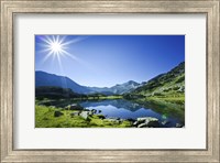 Muratov Lake against blue sky and bright sun in Pirin National Park, Bulgaria Fine Art Print