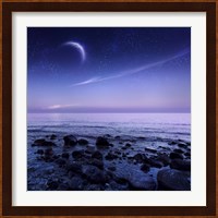 Moon rising over rocky seaside against starry sky Fine Art Print