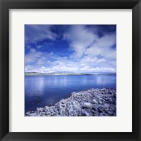 Tranquil lake and rocky shore against cloudy sky, Sardinia, Italy Fine Art Print
