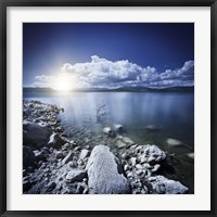 Tranquil lake and rocky shore with sun over horizon, Sardinia, Italy Fine Art Print