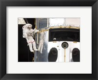 Astronaut performs work on the Hubble Space Telescope Fine Art Print