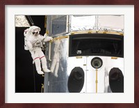 Astronaut performs work on the Hubble Space Telescope Fine Art Print