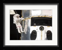 Astronaut performs work on the Hubble Space Telescope Fine Art Print