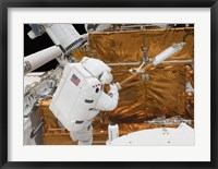 Astronaut works with the Hubble Space Telescope in the cargo bay of Atlantis Fine Art Print