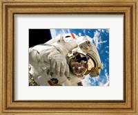 Astronaut taking a spacewalk Fine Art Print