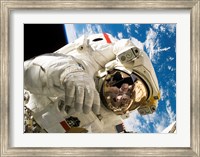 Astronaut taking a spacewalk Fine Art Print
