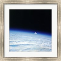 Outer space shot of storm system in early stage of formation with moon in background Fine Art Print