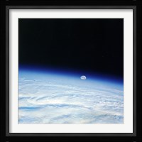 Outer space shot of storm system in early stage of formation with moon in background Fine Art Print