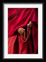 Hands of a monk in red holding prayer beads, Leh, Ladakh, India Fine Art Print