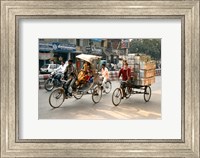 People and cargo move through streets via rickshaw, Varanasi, India Fine Art Print