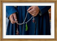 Woman's hands holding prayer beads, Ladakh, India Fine Art Print