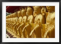 Taiwan, Foukuangshan Temple, Standing gold-colored Buddha statues at a Buddhist shrine Fine Art Print