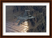 An F-16 Fighting Falcon Releases Flares Fine Art Print