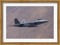An F-22 Raptor on a Training Mission Fine Art Print