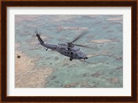 An HH-60G Pave Hawk Along the Coastline of Okinawa, Japan Fine Art Print