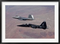 F-22 Raptor and T-38 Talon Fly in Formation over New Mexico Framed Print