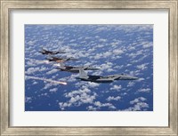 Four F-15 Eagles fly in Formation Over the Pacific Ocean Fine Art Print