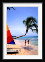 Couple on Beach with Sailboat and Palm Tree, Barbados Framed Print