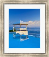 Gazebo reflecting on pool with sea in background, Long Island, Bahamas Fine Art Print