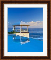 Gazebo reflecting on pool with sea in background, Long Island, Bahamas Fine Art Print