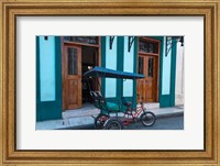 Cuba, Camaquey, bike carriage and buildings Fine Art Print