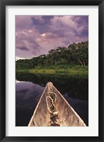 Paddling a dugout canoe on Lake Anangucocha, Yasuni National Park, Amazon basin, Ecuador Fine Art Print