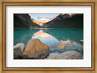 Rocky Mountains and boulders reflected in Lake Louise, Banff National Park, Alberta, Canada Fine Art Print