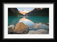 Rocky Mountains and boulders reflected in Lake Louise, Banff National Park, Alberta, Canada Fine Art Print