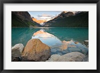 Rocky Mountains and boulders reflected in Lake Louise, Banff National Park, Alberta, Canada Fine Art Print