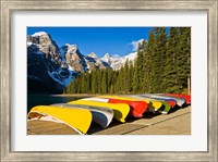 Moraine Lake and rental canoes stacked, Banff National Park, Alberta, Canada Fine Art Print