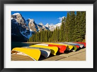 Moraine Lake and rental canoes stacked, Banff National Park, Alberta, Canada Fine Art Print