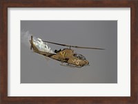 An AH-1S Tzefa of the Israeli Air Force dispenses flares Fine Art Print