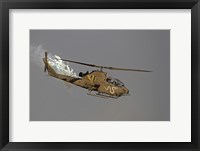 An AH-1S Tzefa of the Israeli Air Force dispenses flares Fine Art Print