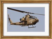 An AH-1S Tzefa helicopter in flight Fine Art Print