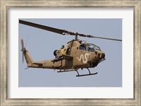 An AH-1S Tzefa helicopter in flight Fine Art Print