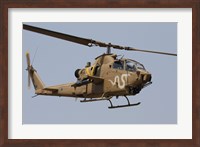An AH-1S Tzefa helicopter in flight Fine Art Print
