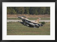 An F-16C Barak of the Israeli Air Force taking off from Hatzor Air Force Base Fine Art Print