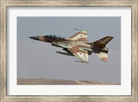 An F-16B Netz of the Israeli Air Force in flight over Israel Fine Art Print