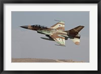 An F-16B Netz of the Israeli Air Force in flight over Israel Fine Art Print