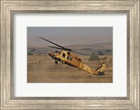 An UH-60L Yanshuf helicopter of the Israeli Air Force Fine Art Print
