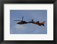 An F-16 Falcon and AH-64 Apache from the Royal Netherlands Air Force Fine Art Print