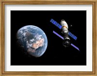 A manned Soyuz TMA-M spacecraft docked with an extended stay module Fine Art Print