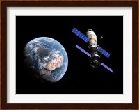 A manned Soyuz TMA-M spacecraft docked with an extended stay module Fine Art Print