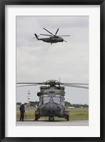A German Army NH90 and its Predecessor, the CH-53 Sea Stallion Fine Art Print