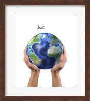 Man's Hands Holding the Planet Earth, with a Jet Aircraft Flying Above Fine Art Print