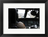 A UH-60 Blackhawk flies the River to an Unknown Village to Drop off a Care Package Fine Art Print