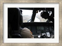 A UH-60 Blackhawk flies the River to an Unknown Village to Drop off a Care Package Fine Art Print