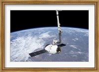 The SpaceX Dragon Cargo Craft in the Grasp of the Canadarm2 Fine Art Print