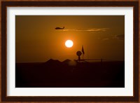 UH-60 Blackhawk Flies Over Camp Speicher Airfield at Sunset Fine Art Print
