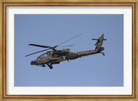 AH-64 Apache in flight over the Baghdad Hotel in central Baghdad, Iraq Fine Art Print